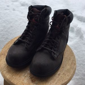 Steel toed work boots with leather shoestrings